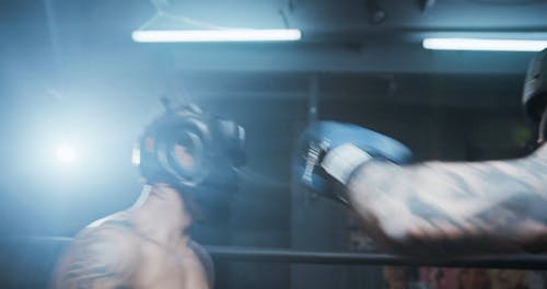 Two Boxers Sparring In Training