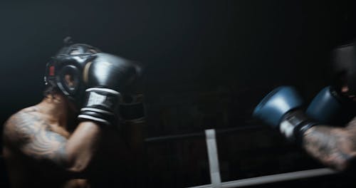 Two Boxers Sparring In The Ring