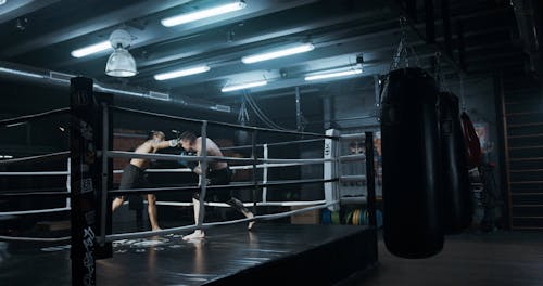 Two Men Sparring In Kick Boxing