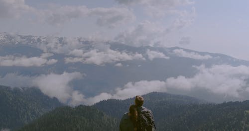 Couple Enjoying A Scenic View Of The Mountains