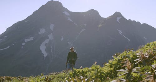 Video Of Man Walking On Top Of The Mountain