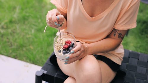 Video Of Holding A Glass Of Granola And Yoghurt