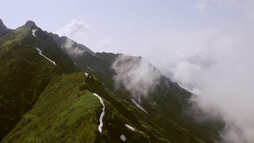 A Mountain Peak Trail Covered With Snow 