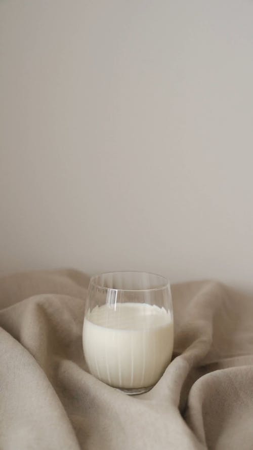 Video Of Person Pouring Coffee On Milk