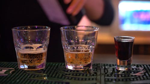 A Bartender Preparing Hard Drink On The Bar Counter