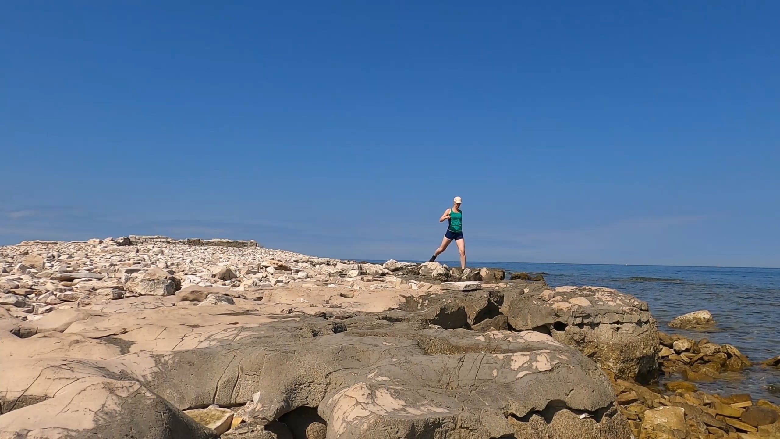 A Woman Hopping On Rocks In The Rocky Shore Free Stock Video Footage ...