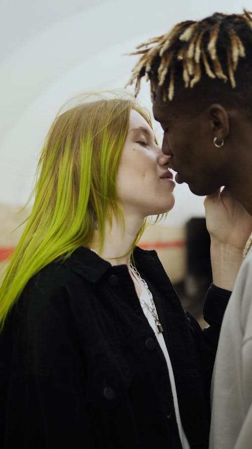 A Couple Kissing On The Subway Station Platform