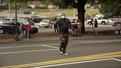 Man Dance on the Street While Walking