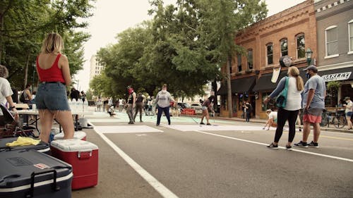 People Doing Black Lives Matter Mural Painting In The Street