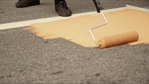 Street Rulo Paint People Painting In The Street With Mural · Free Stock Video
