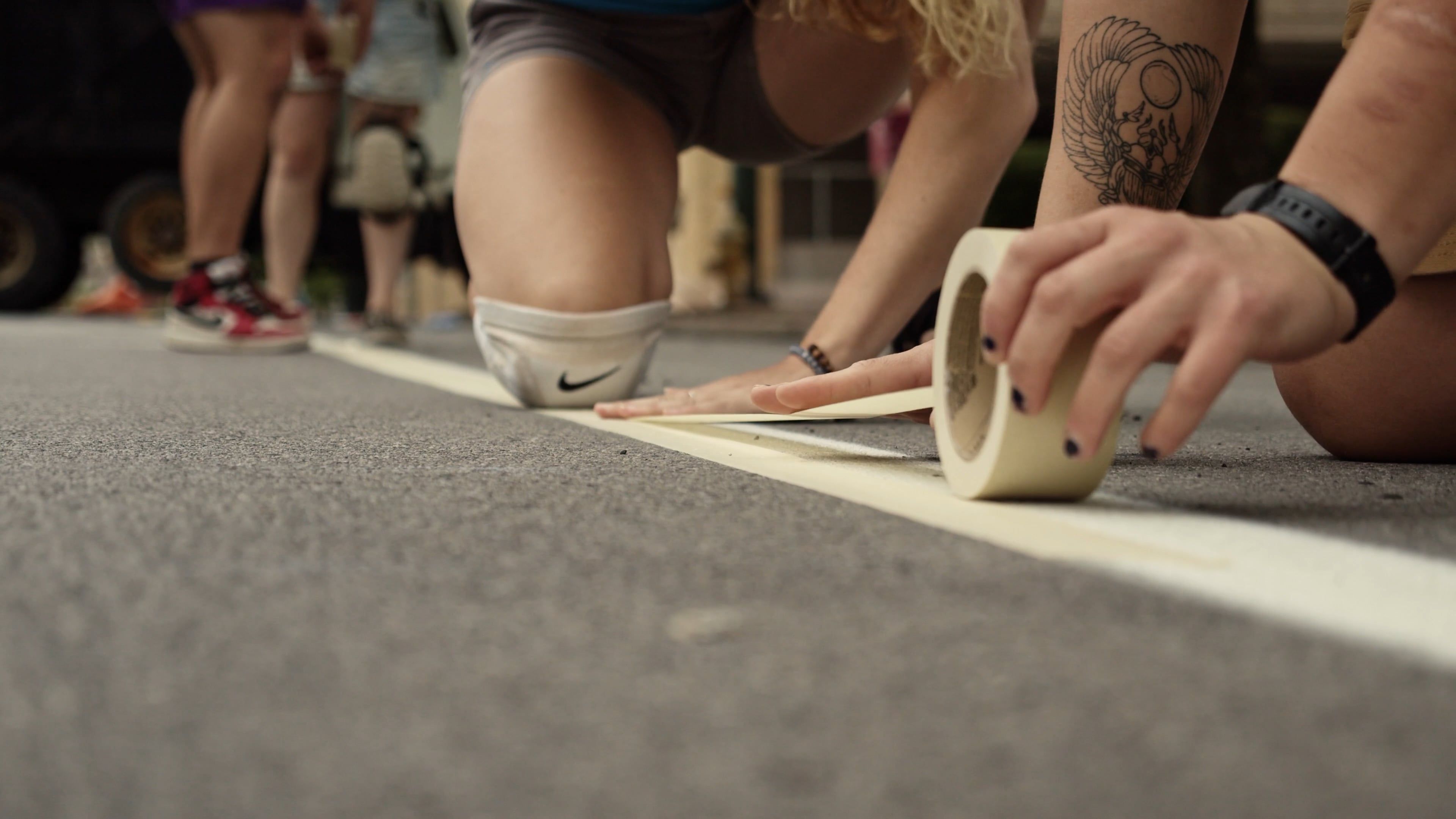 Video Of People Putting Tape On Pavement Free Stock Video Footage ...