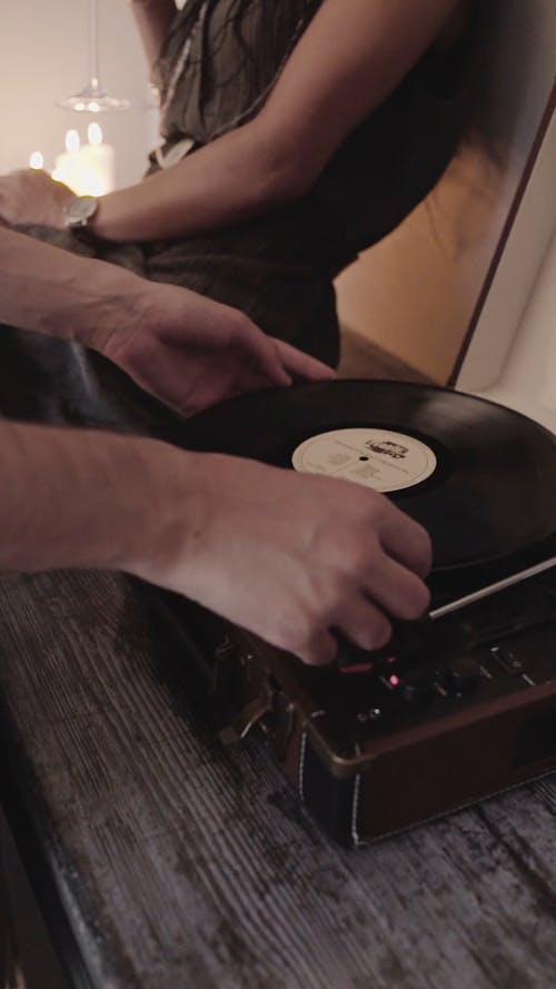 Video Of Person Putting Vinyl Record On Turn Table 