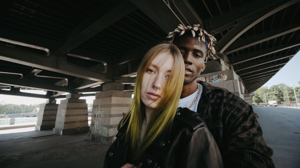 A man and woman standing under a bridge Free Stock Video Footage ...
