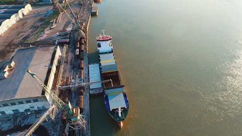 Loading A Cargo Ship Hatch At The Loading Area