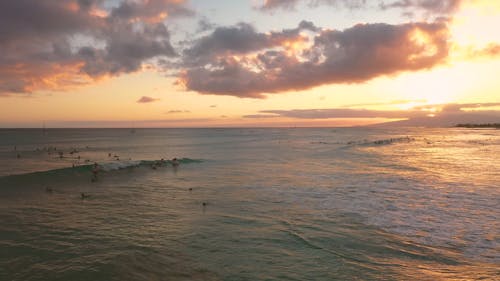 Surfing The Waves Of The Beach In Hawaii