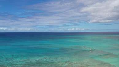 aerial view of seascape under white clouds