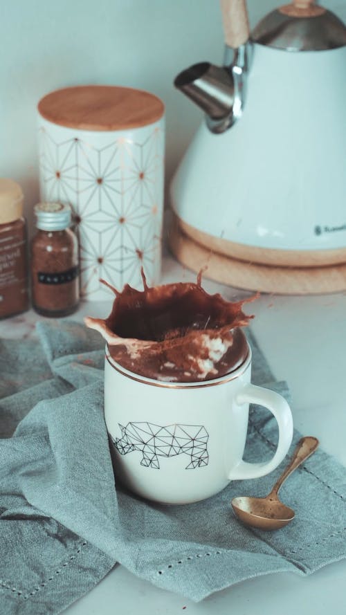 Video Of Dropping Of Cookie On A Cup Of Chocolate Drink