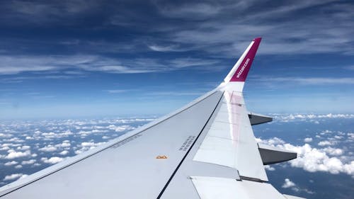 Airplane Wing Against Blue Sky