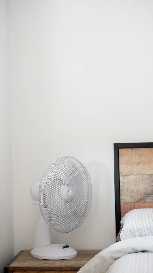 White Electric Fan Near White Wall