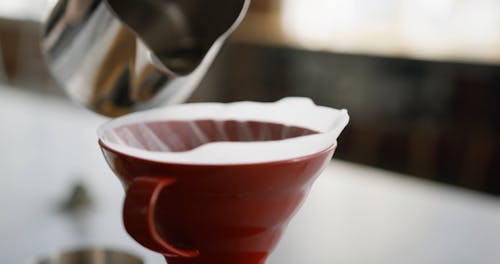 Pouring Hot Water On A Cup With Filter