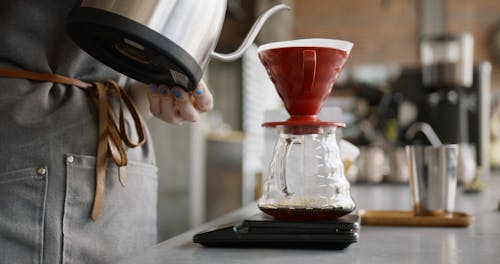 Pouring Hot Water To Make A Brewed Coffee