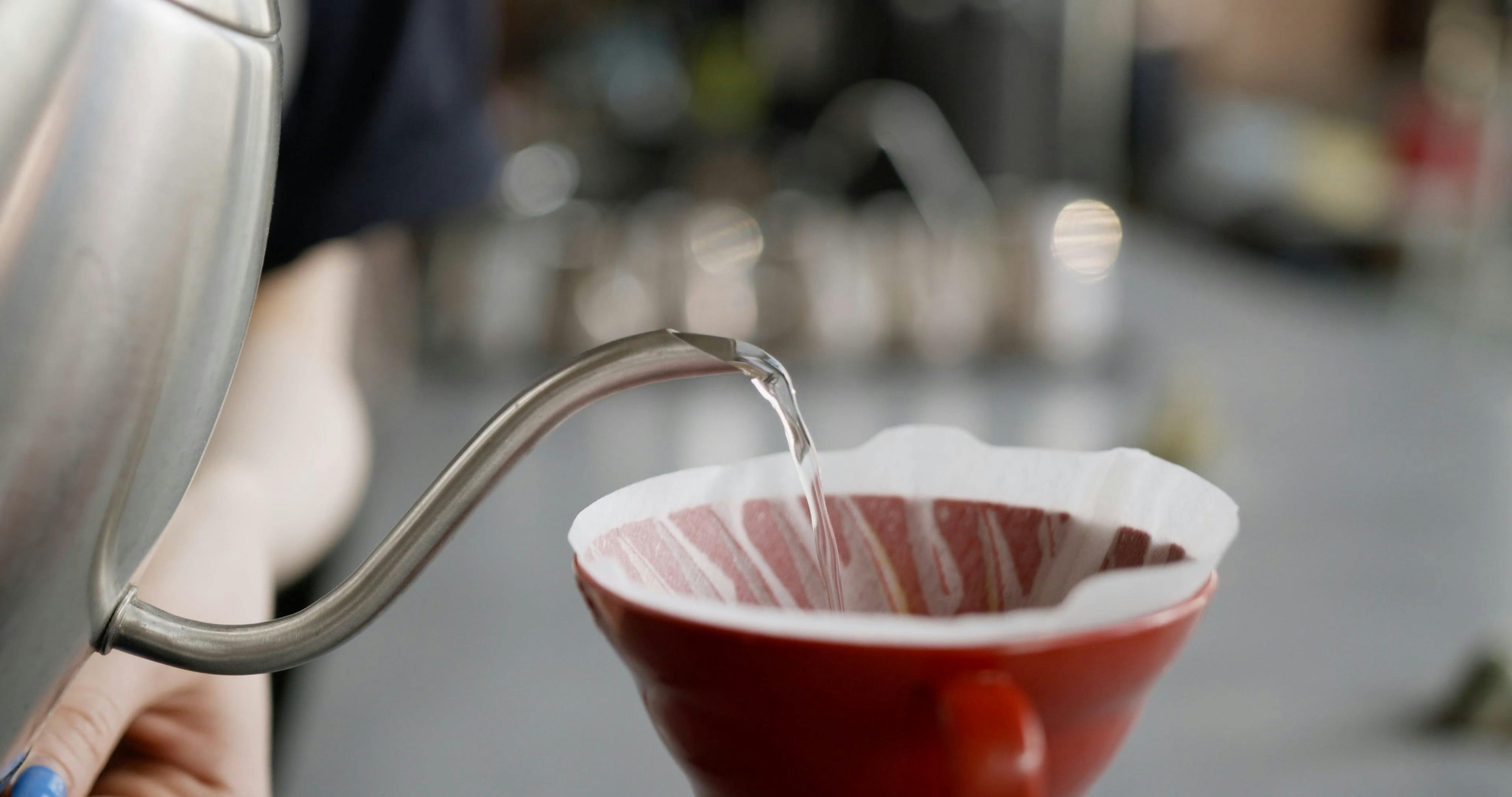 Poring Hot Water Over A Filtered Cup · Free Stock Video