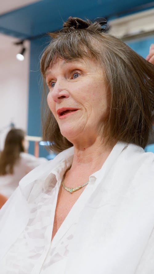 Woman Talking While Getting Her Hair Done