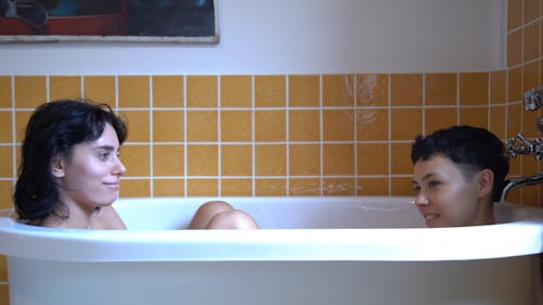 A Gay Couple Sharing The Bath Tub