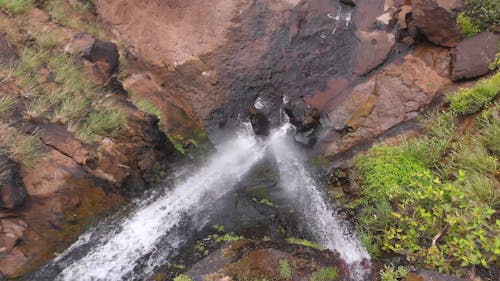 Drone Footage Of Waterfalls Flowing Through Creeks