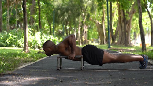 Topless Man Doing Push-Ups