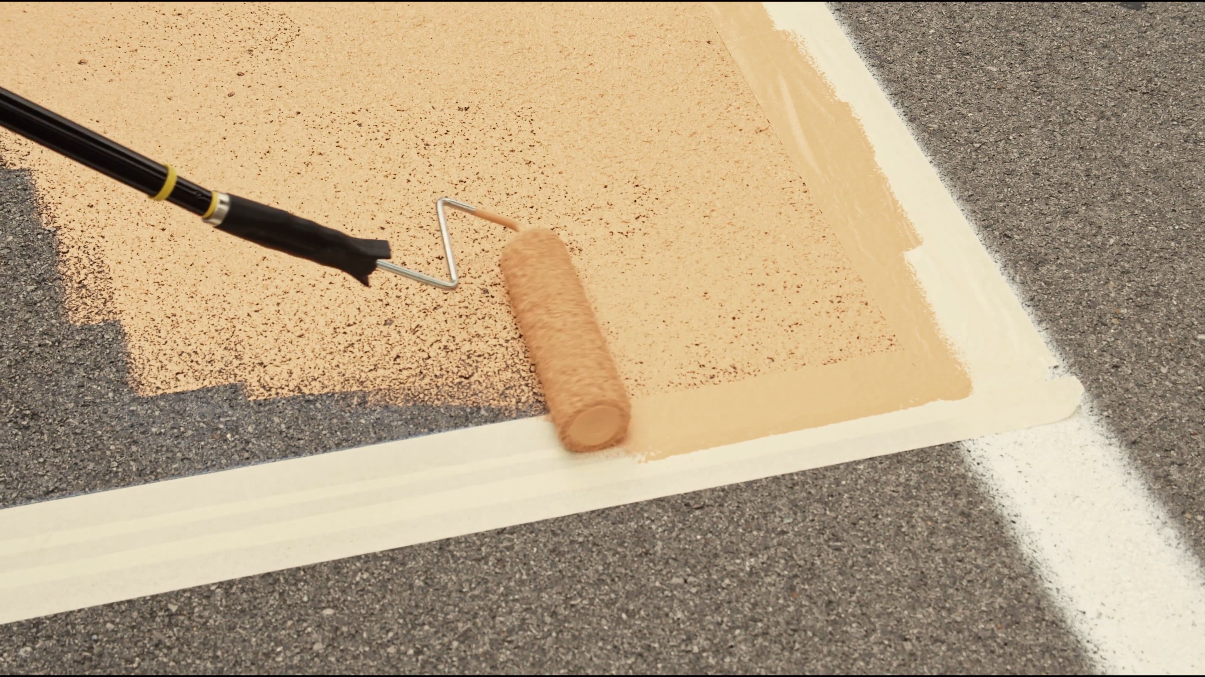 Video Of People Using Paint Rollers To Paint The Road · Free Stock Video