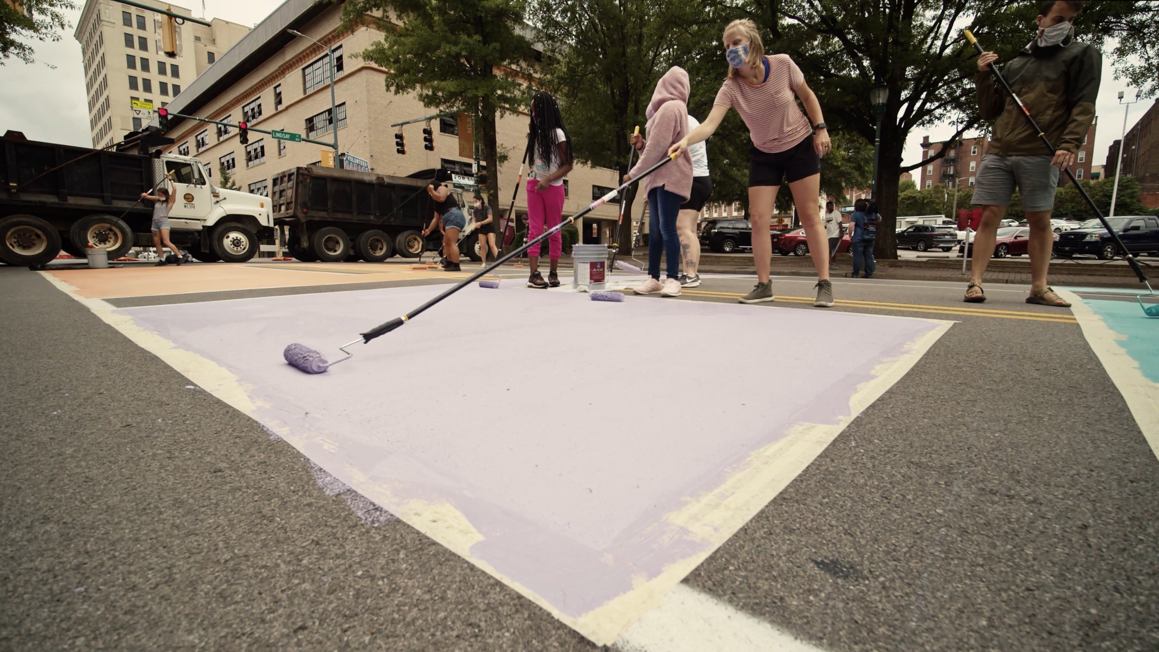 Street Rulo Paint Video Of People Using Paint Rollers To Paint The Road · Free Stock Video