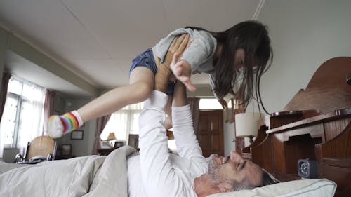 Father Playing with her Daughter