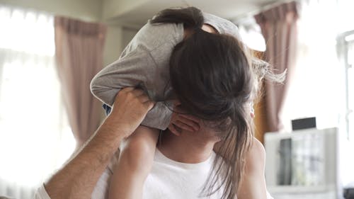 Dad Carrying Her Daughter on His Back