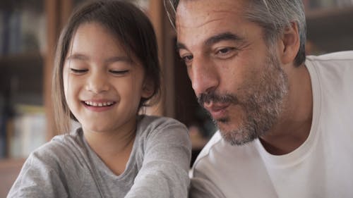 Dad and Daughter Having Fun Playing