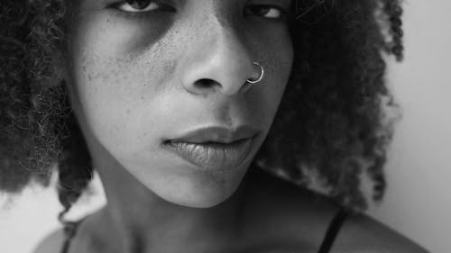 Close-up Footage Of A Woman's Face With A Nose Piercing