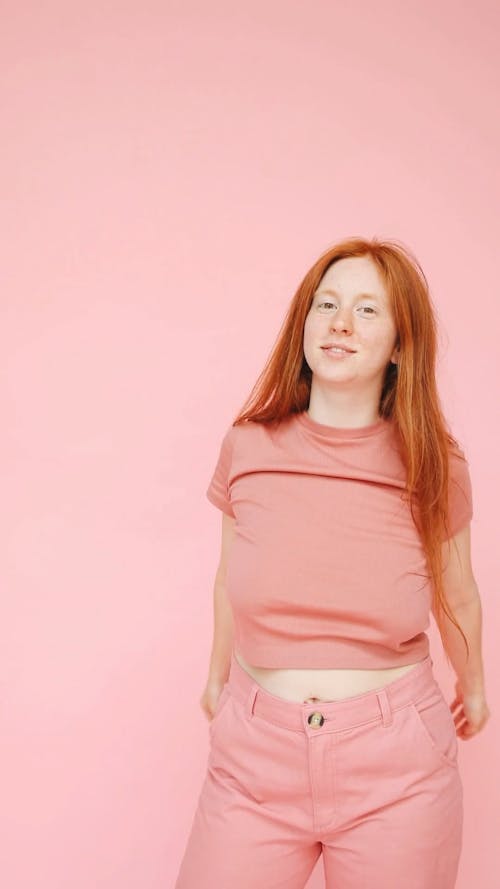 Woman in Pink Shirt and Pink Pants Smiling