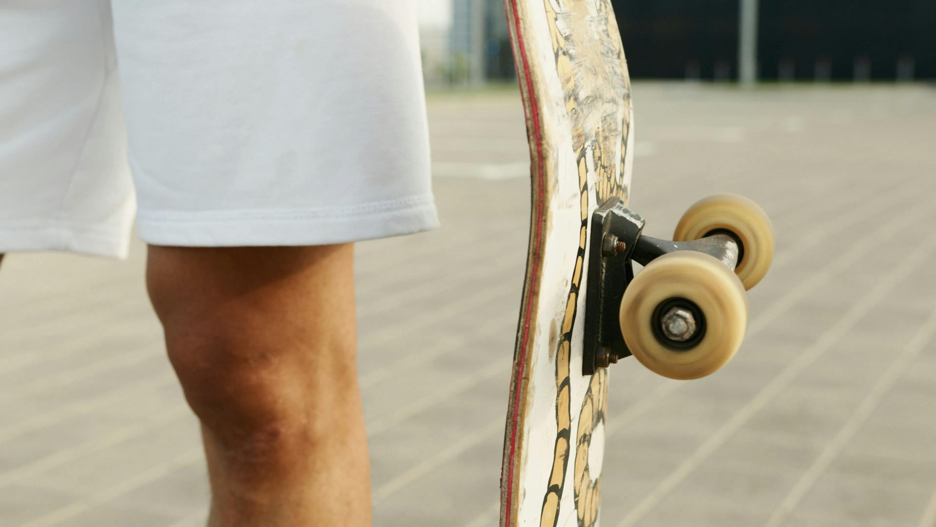CloseUp View of Spinning Wheel of Skateboard · Free Stock Video