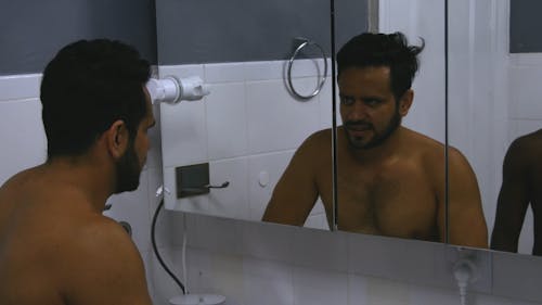 Two Men Brushing Their Teeth