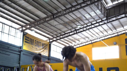 Man and Woman Doing Exercise With a Medicine Ball