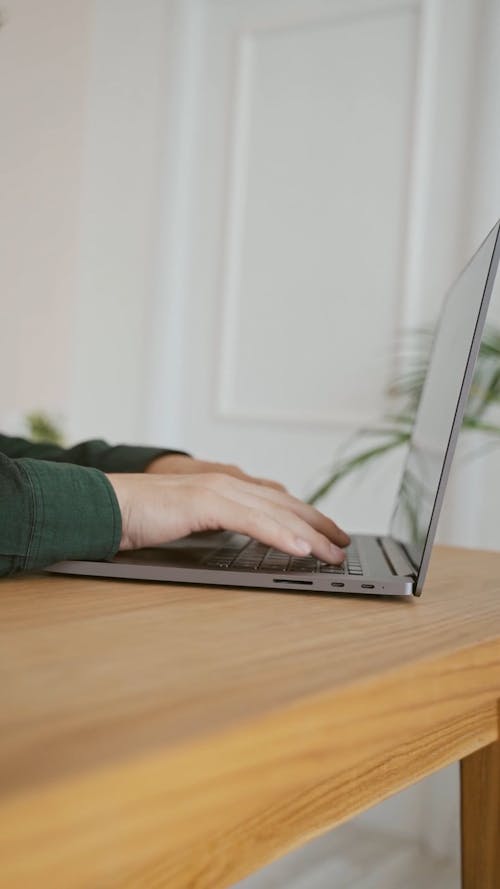 Person Typing on a Laptop