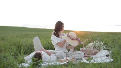 Couple Having a Picnic Outdoors