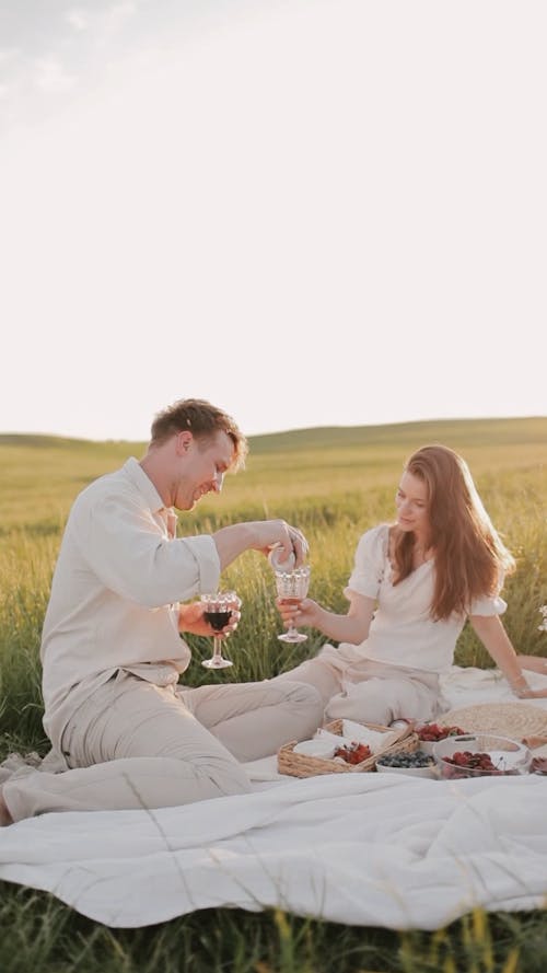 Couple Having a Picnic Outdoors