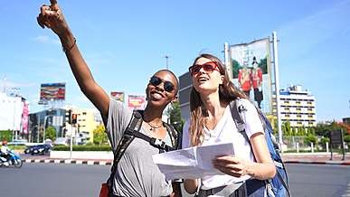 two women looking at a map