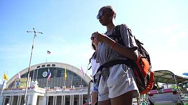 women in backpacks traveling