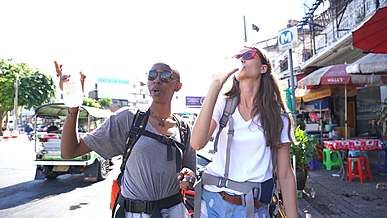 two women talking and drinking bottled water