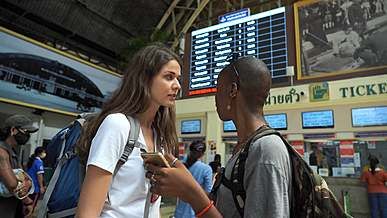 backpackers at a train station