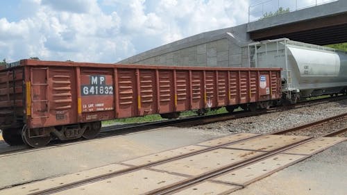 A Train Passing Under a Bridge