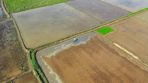 High Angle Shot of Person Tilling His Farmland