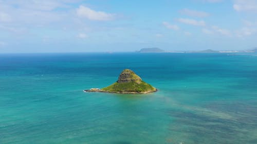 Drone Footage of Islet Scenery Under Blue Sky